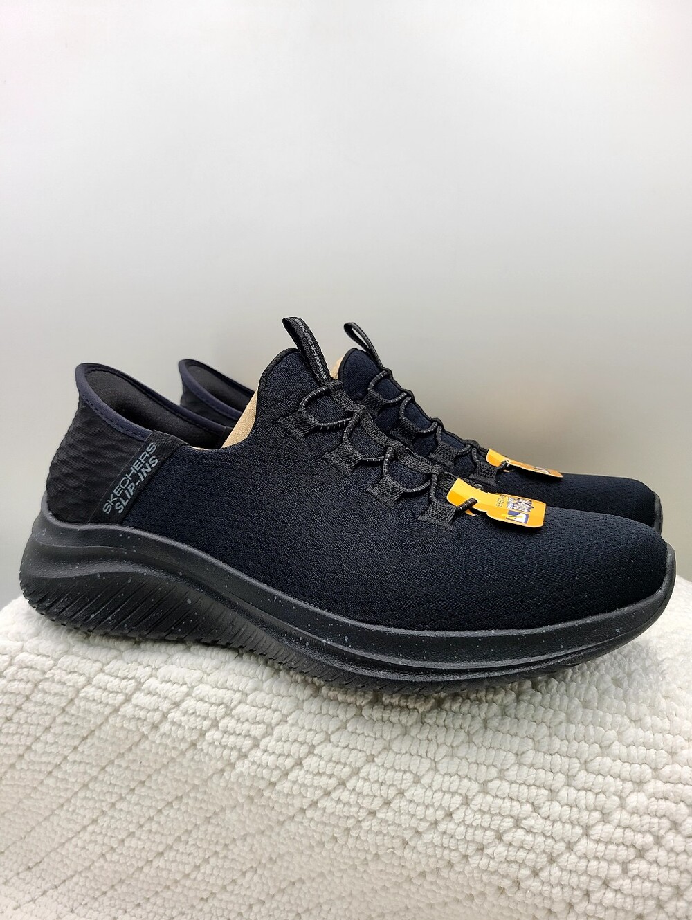 Skechers Men's Black Slip-On Water-Ready Knit Sneakers with Yellow Accents